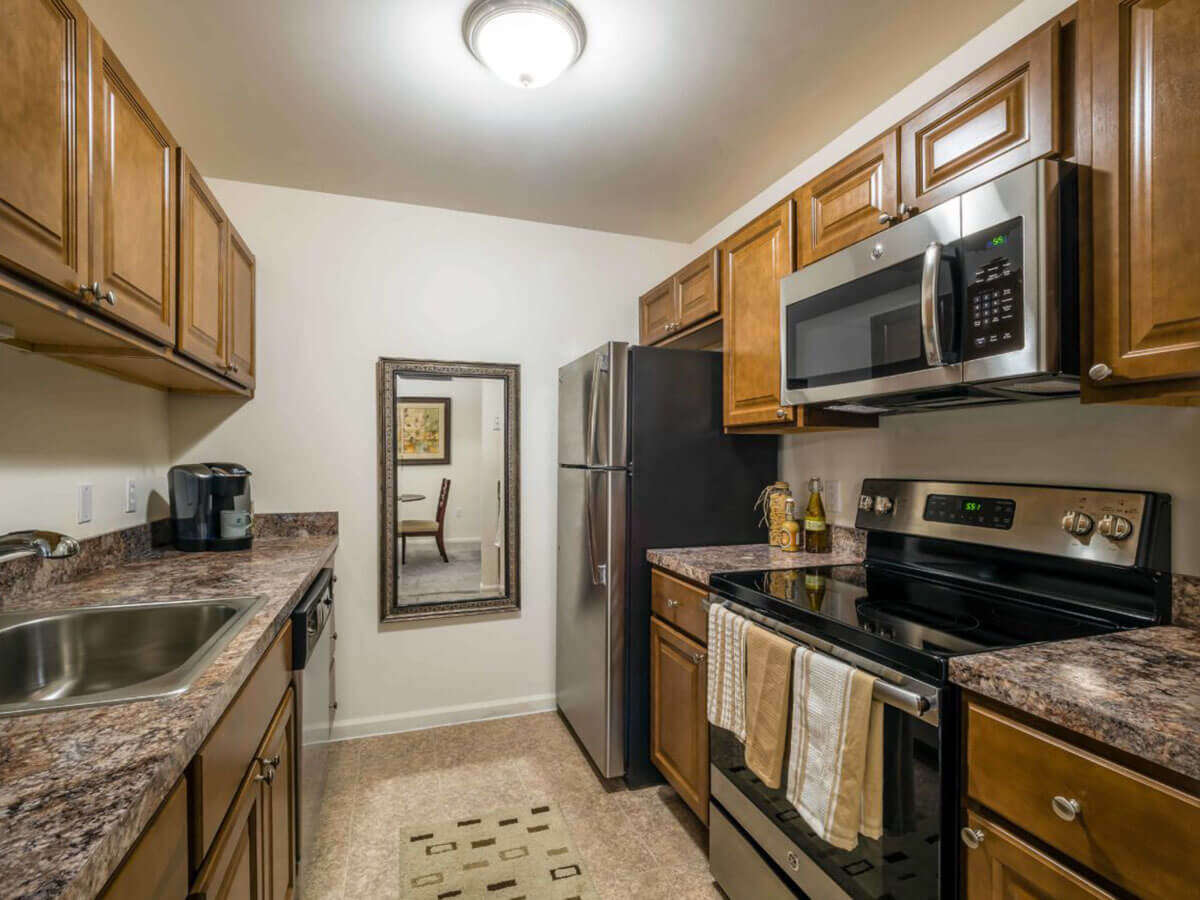 Pointe North apartment rental with wooden cabinetry in spacious kitchen in Bethlehem, PA
